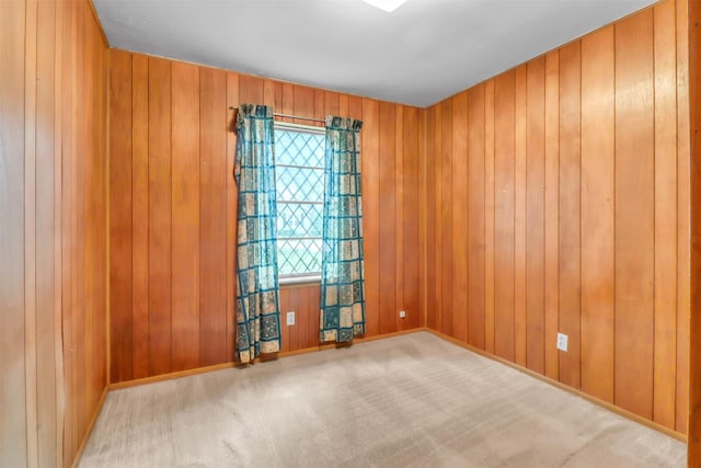 2509 Bayou Ave, Baytown, TX 77520 - unfurnished room featuring carpet floors, wood walls, and baseboards