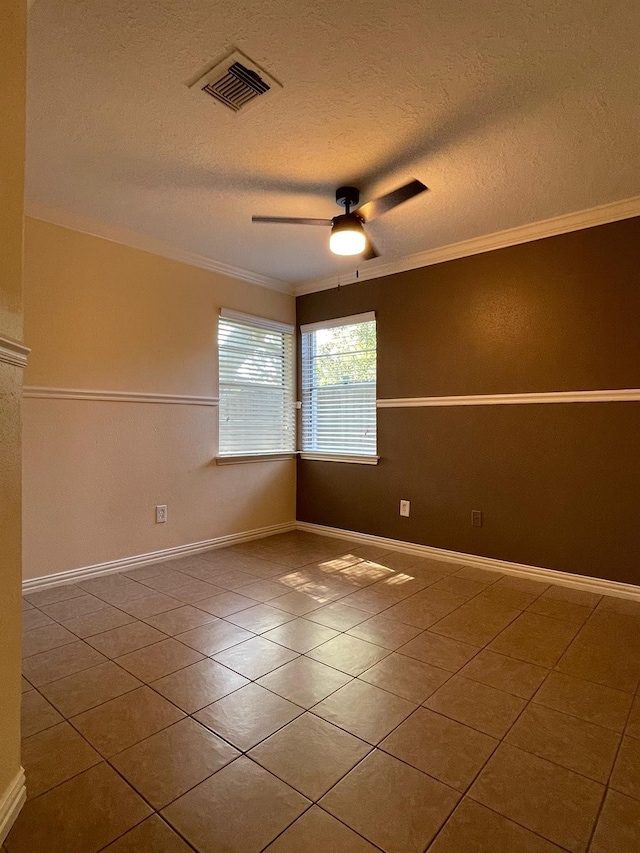 2503 Radcliffe Dr, Sugar Land, TX 77498 - tiled empty room featuring ornamental molding, a ceiling fan, and a textured ceiling
