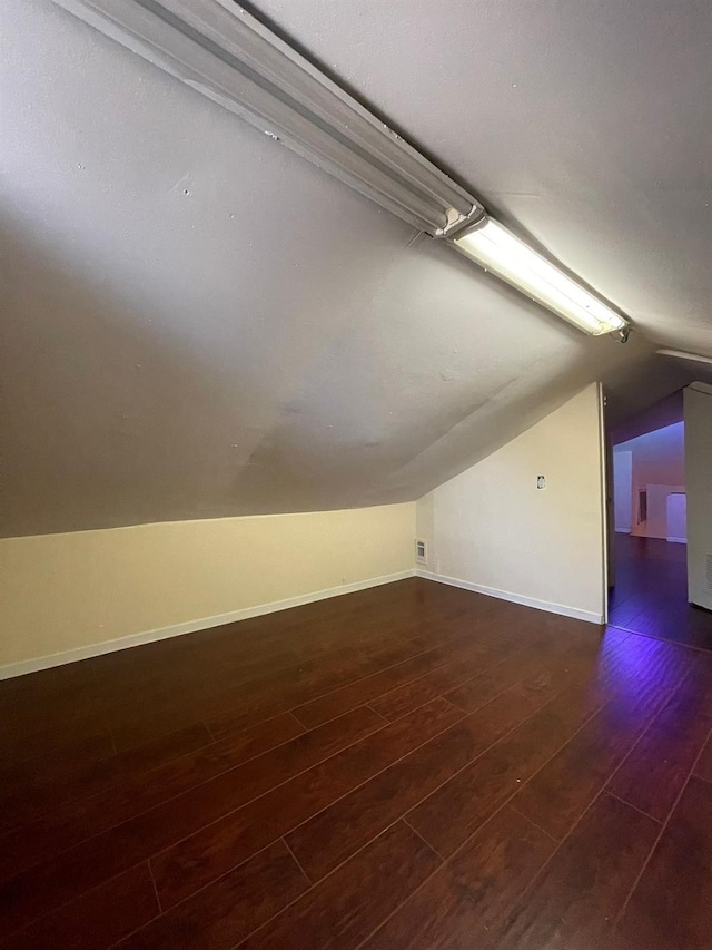2503 Radcliffe Dr, Sugar Land, TX 77498 - bonus room with vaulted ceiling and dark wood-style flooring
