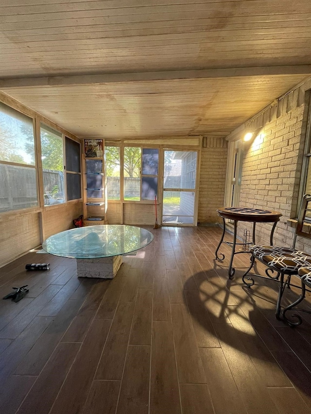 2503 Radcliffe Dr, Sugar Land, TX 77498 - sunroom with wood ceiling, hardwood / wood-style flooring, brick wall, and a deck