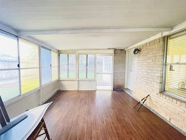 2503 Radcliffe Dr, Sugar Land, TX 77498 - unfurnished sunroom featuring brick wall, wood finished floors, and plenty of natural light