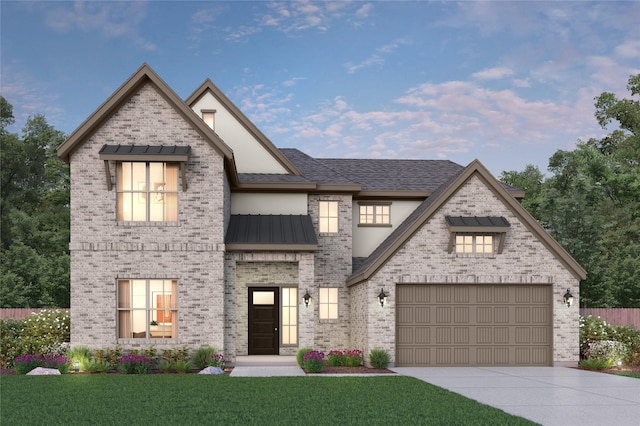 view of front of house featuring brick siding, a standing seam roof, driveway, a front yard, and an attached garage