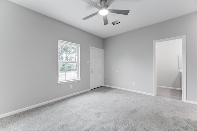 unfurnished room with carpet, baseboards, and ceiling fan