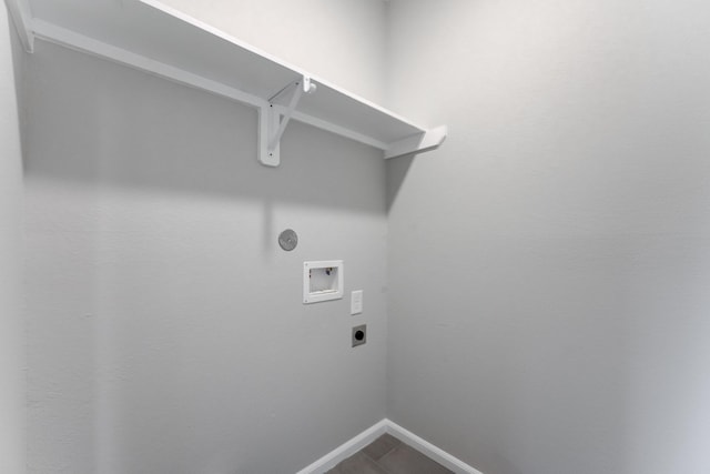 laundry room featuring electric dryer hookup, hookup for a washing machine, baseboards, and laundry area