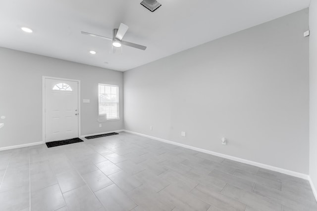 foyer entrance featuring a ceiling fan, baseboards, and recessed lighting