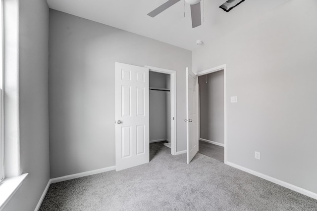 unfurnished bedroom featuring carpet flooring, a closet, baseboards, and ceiling fan