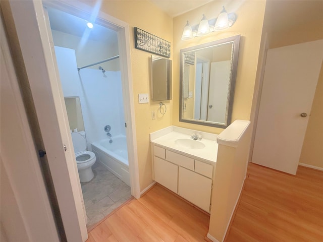 full bathroom with toilet, vanity, washtub / shower combination, and wood finished floors