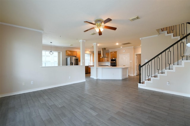 18719 Racquet Sports Way, Humble, TX 77346 - unfurnished living room featuring a ceiling fan, baseboards, ornamental molding, stairs, and dark wood finished floors