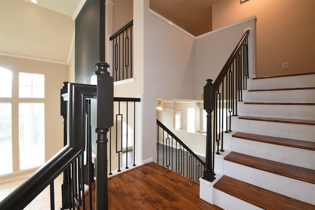 18719 Racquet Sports Way, Humble, TX 77346 - staircase with healthy amount of natural light, wood finished floors, a ceiling fan, and baseboards