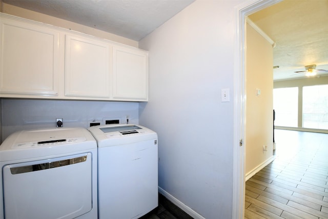 18719 Racquet Sports Way, Humble, TX 77346 - laundry room with cabinet space, washing machine and clothes dryer, baseboards, ceiling fan, and wood finished floors