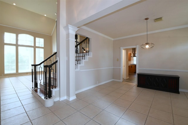 18719 Racquet Sports Way, Humble, TX 77346 - empty room featuring light tile patterned floors, ornamental molding, stairway, baseboards, and decorative columns