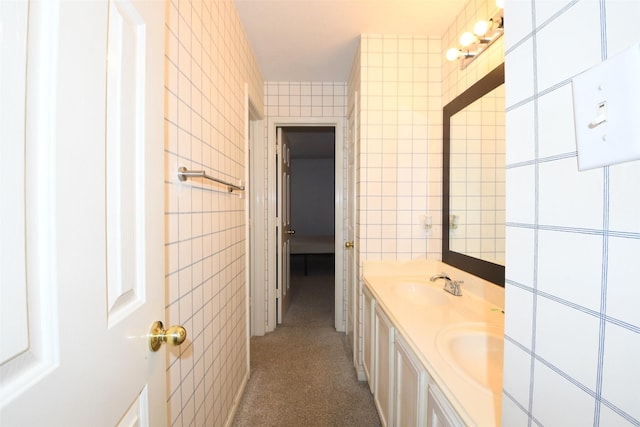 18719 Racquet Sports Way, Humble, TX 77346 - bathroom featuring tile walls and double vanity