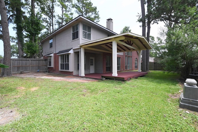 18719 Racquet Sports Way, Humble, TX 77346 - rear view of house with a chimney, a patio area, a wooden deck, and brick siding
