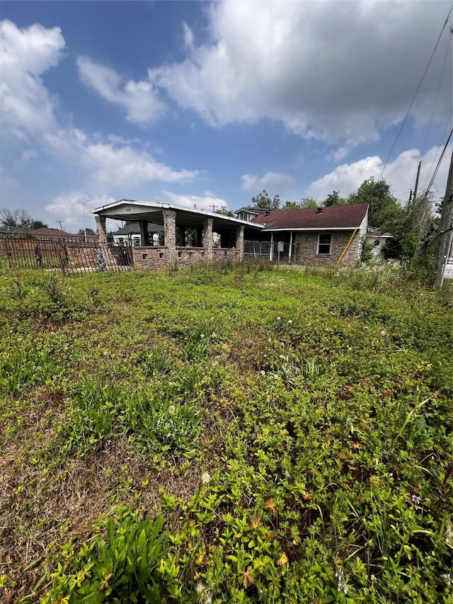 view of yard featuring fence