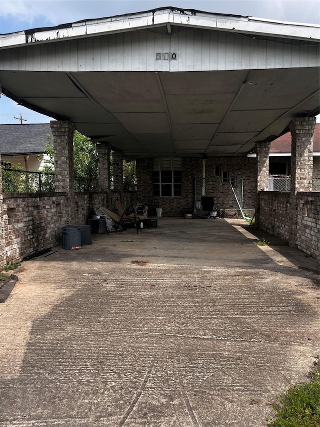 view of vehicle parking with a carport