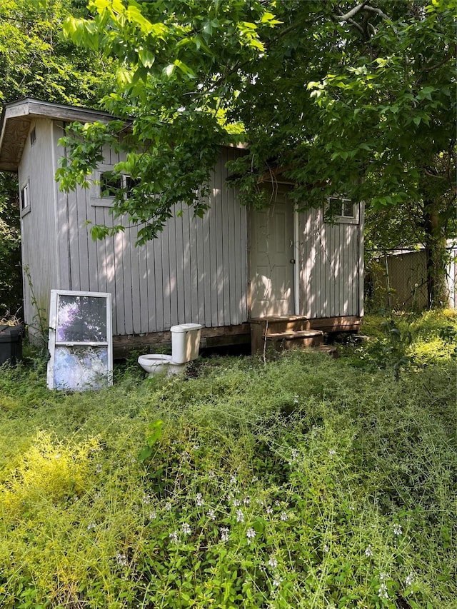 exterior space with fence and an outdoor structure