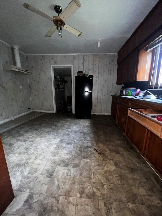 kitchen with baseboards, a ceiling fan, and freestanding refrigerator