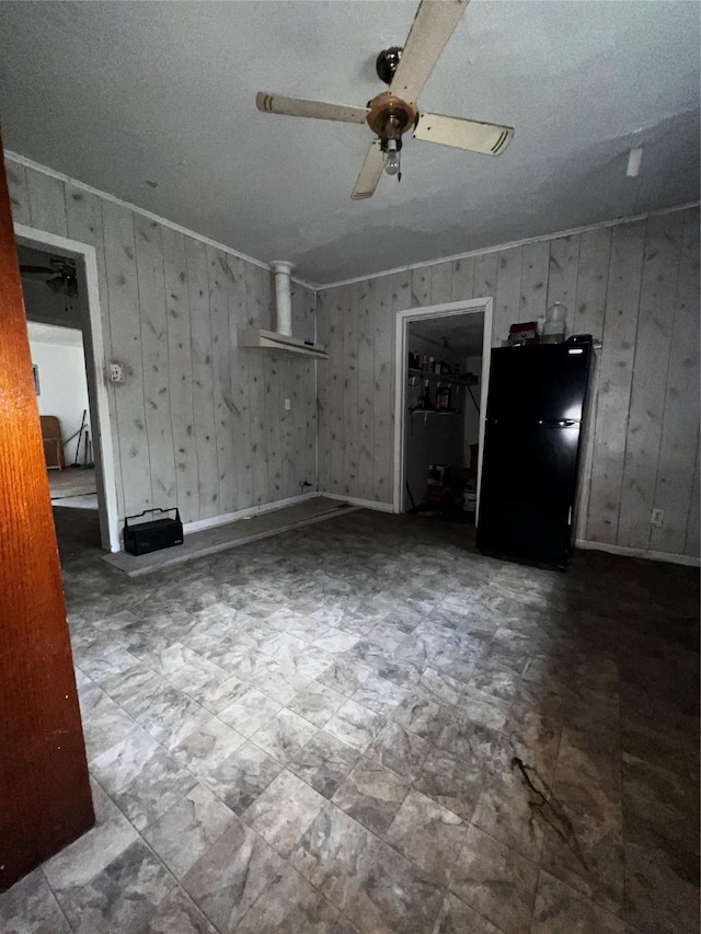 unfurnished living room with baseboards, ceiling fan, and tile patterned floors