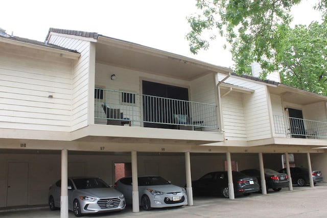 view of property featuring covered parking