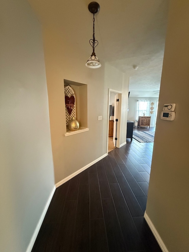 9319 Dalmore Ct, Houston, TX 77095 - corridor with baseboards and dark wood finished floors