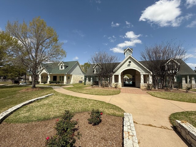 9319 Dalmore Ct, Houston, TX 77095 - view of front of property with stone siding, a chimney, fence, and a front yard