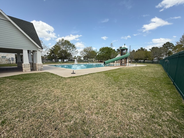 9319 Dalmore Ct, Houston, TX 77095 - community pool with playground community, a water slide, fence, and a yard
