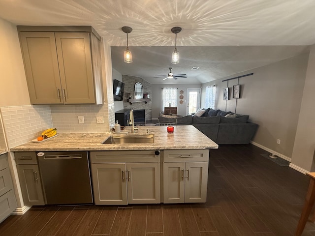 9319 Dalmore Ct, Houston, TX 77095 - kitchen featuring dark wood-style flooring, stainless steel dishwasher, a sink, ceiling fan, and a peninsula