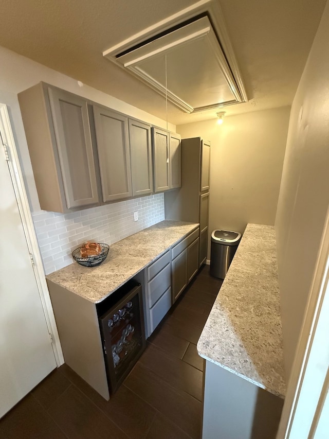 9319 Dalmore Ct, Houston, TX 77095 - kitchen featuring gray cabinetry, dark wood-style flooring, light stone countertops, and tasteful backsplash