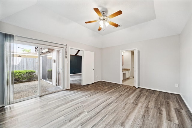 2825 Camelot Ln, Missouri City, TX 77459 - unfurnished room with ceiling fan, baseboards, wood finished floors, and visible vents