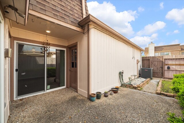 2825 Camelot Ln, Missouri City, TX 77459 - view of side of property featuring fence, a gate, and central AC unit