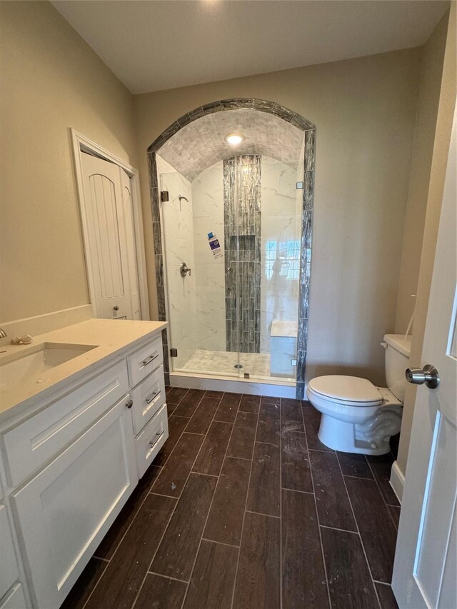 9830 Turnbow St, Houston, TX 77029 - bathroom featuring wood finish floors, vanity, toilet, and a tile shower