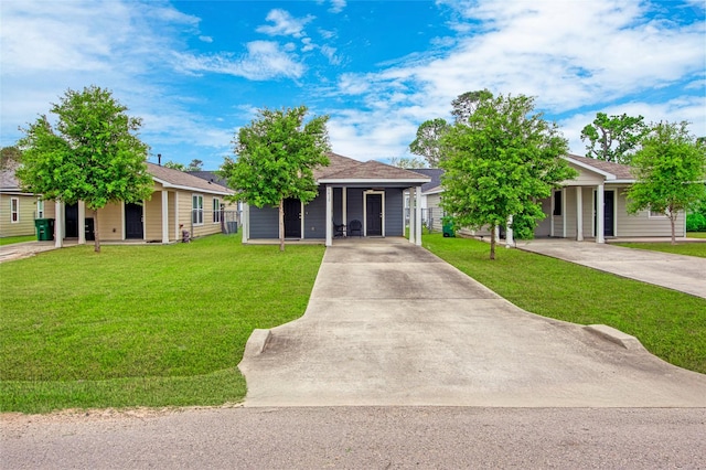 ranch-style house featuring a front yard and concrete driveway