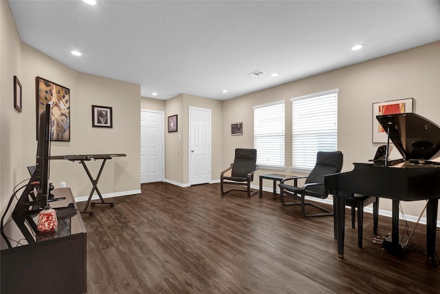 sitting room with baseboards, dark wood-style flooring, visible vents, and recessed lighting