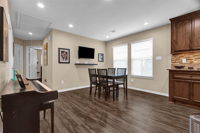 dining space with attic access, baseboards, dark wood-type flooring, and recessed lighting