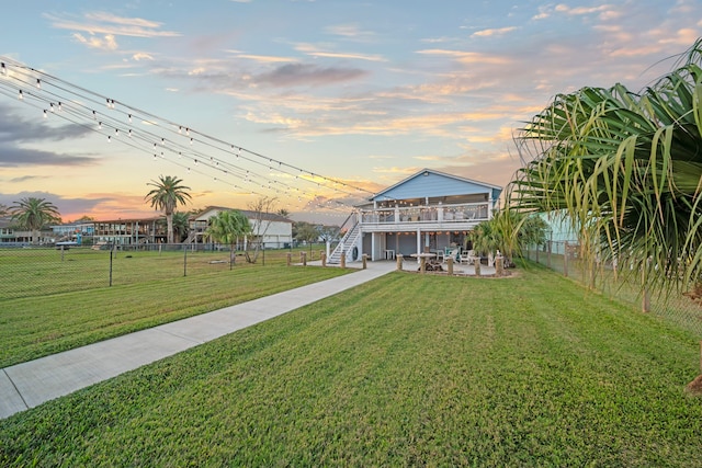 1407 John St, San Leon, TX 77539 - view of front of house featuring stairway, a patio, and a deck
