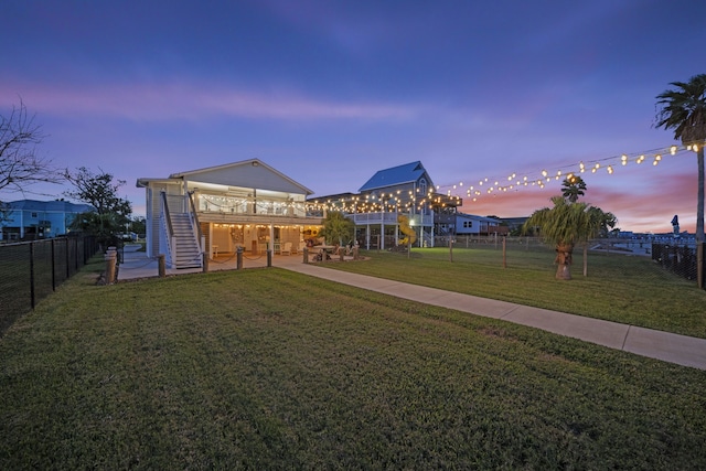 1407 John St, San Leon, TX 77539 - view of yard with stairs, a wooden deck, and a patio