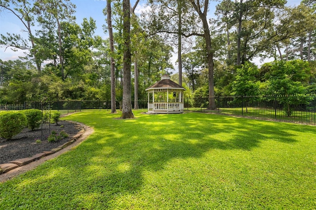 view of yard with a fenced backyard and a gazebo