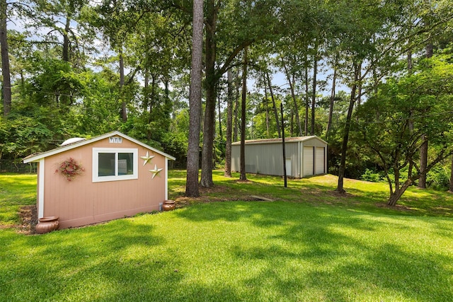 view of yard featuring an outbuilding and a detached garage