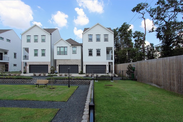 5502 Wheatley St Unit E, Houston, TX 77091 - back of property with brick siding, a garage, fence, and a yard