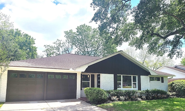single story home with concrete driveway, brick siding, roof with shingles, and a garage