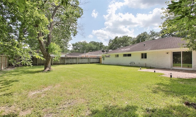 view of yard with a fenced backyard and a patio