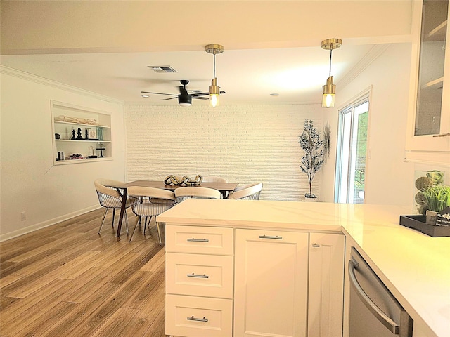 kitchen featuring visible vents, white cabinetry, a ceiling fan, crown molding, and dishwasher