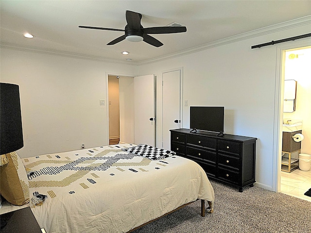 bedroom featuring connected bathroom, recessed lighting, and ornamental molding