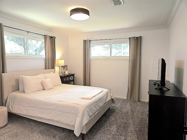 bedroom with crown molding, visible vents, carpet, and multiple windows