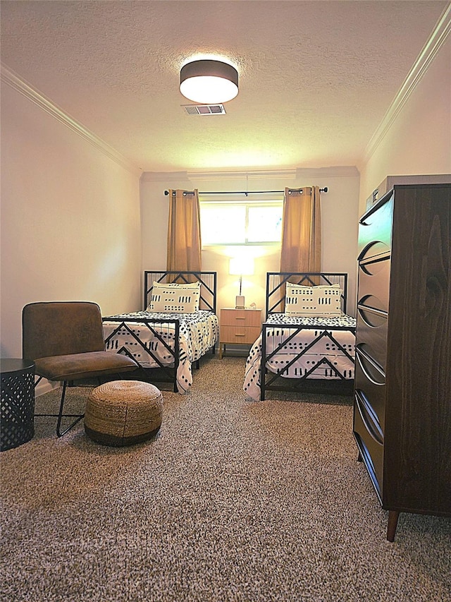 bedroom featuring carpet floors, a textured ceiling, ornamental molding, and visible vents