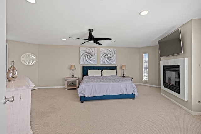carpeted bedroom featuring baseboards, a fireplace, recessed lighting, and a ceiling fan
