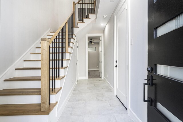 2218 Francis St, Houston, TX 77004 - stairs featuring ceiling fan, a high ceiling, and baseboards