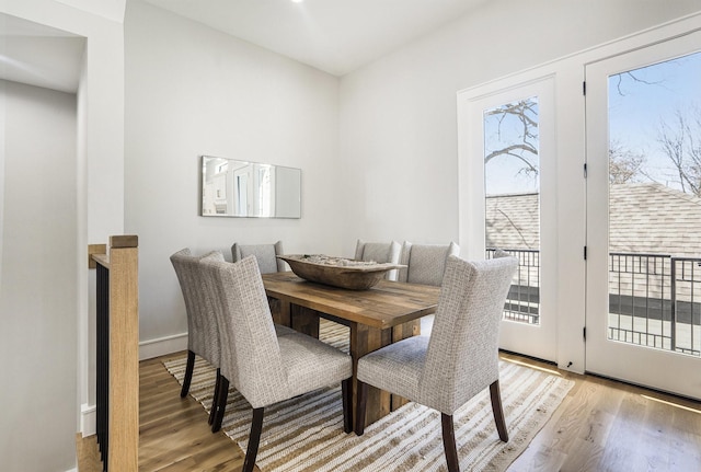 2218 Francis St, Houston, TX 77004 - dining room with a wealth of natural light, light wood-style floors, and baseboards