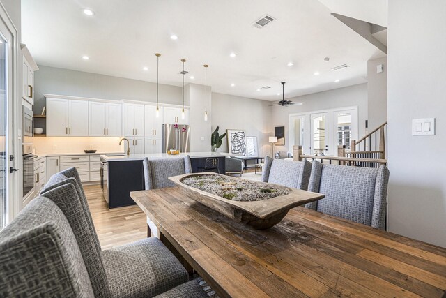 2218 Francis St, Houston, TX 77004 - dining space with recessed lighting, visible vents, ceiling fan, and light wood-style floors