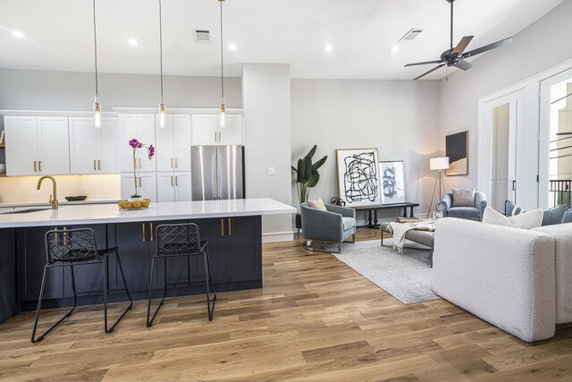2218 Francis St, Houston, TX 77004 - kitchen featuring a sink, visible vents, light countertops, open floor plan, and stainless steel refrigerator